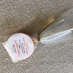 an orange lollipop without childproof cannabis packaging